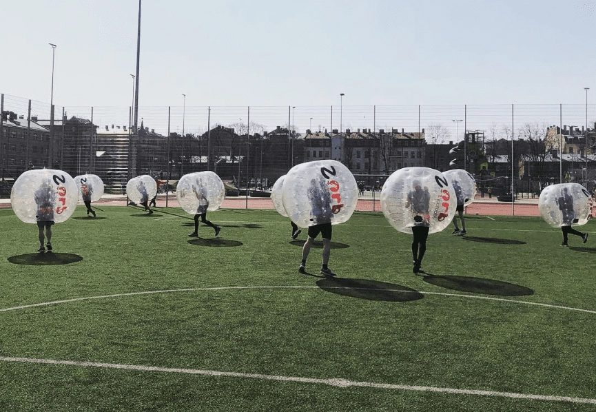 Bubble football match in the sun